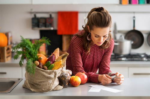 Woman with groceries for a healthy Thanksgiving dinner