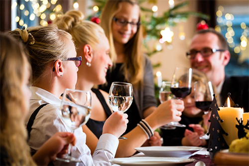 Family and friends celebrating healthy holiday dieting