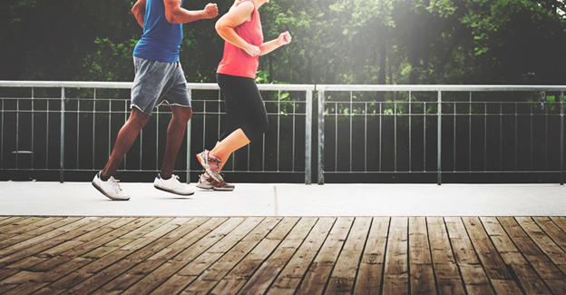 Man and woman running together to increase workout accountability