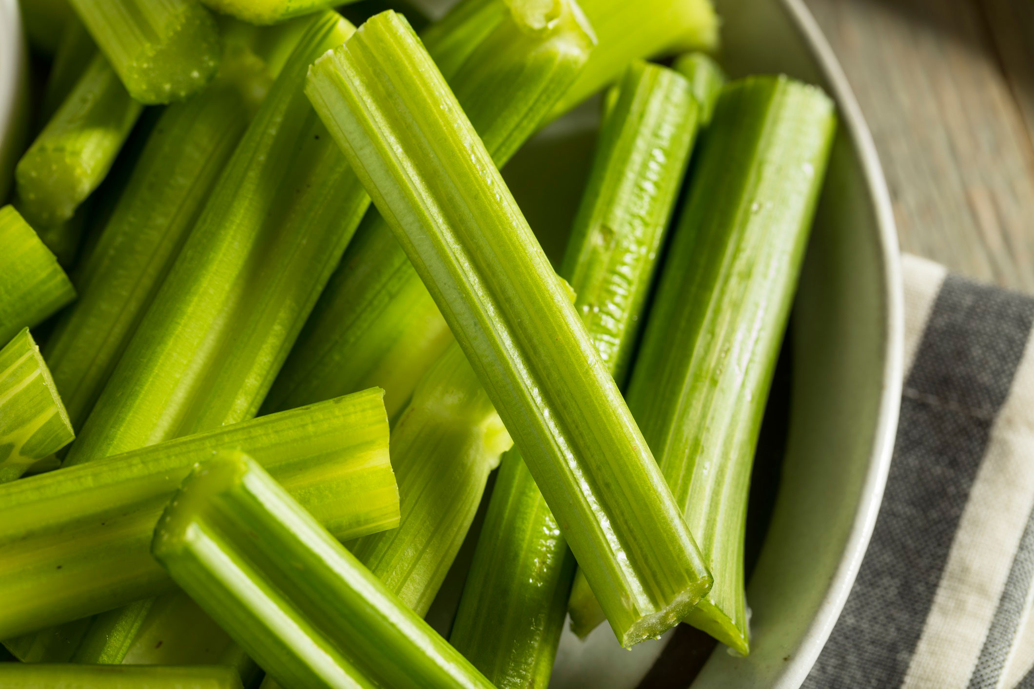 Close up of bowl of celery sticks.